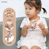 A baby is shown interacting with a silicone rattle and sensory ball, demonstrating gnaw, pull, and touch sensations.