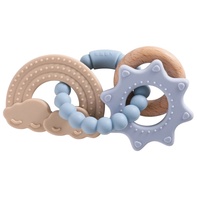 A set of silicone teether rings shaped like a rainbow, cloud, and star for babies.