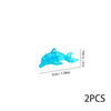 Two translucent blue plastic marine creature building blocks.