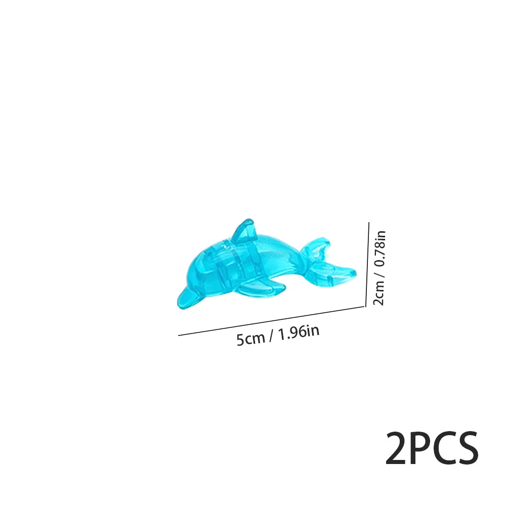 Two translucent blue plastic marine creature building blocks.