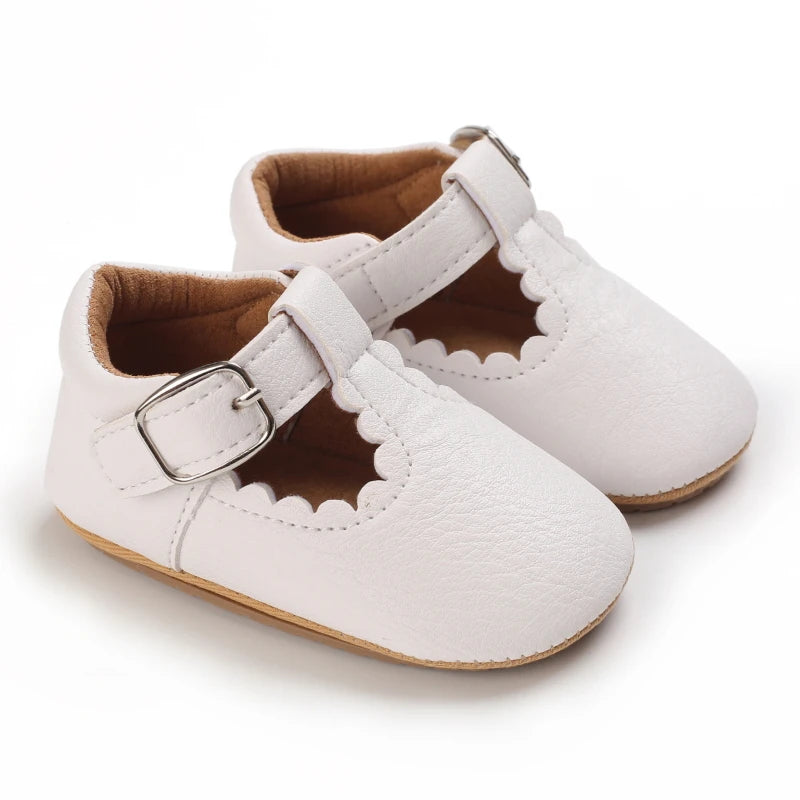 A pair of white breathable baby first walker sandals with soft anti-slip soles.