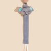 A gray elephant pacifier holder with soft blue ears and a wooden clip attached to a gray strap.