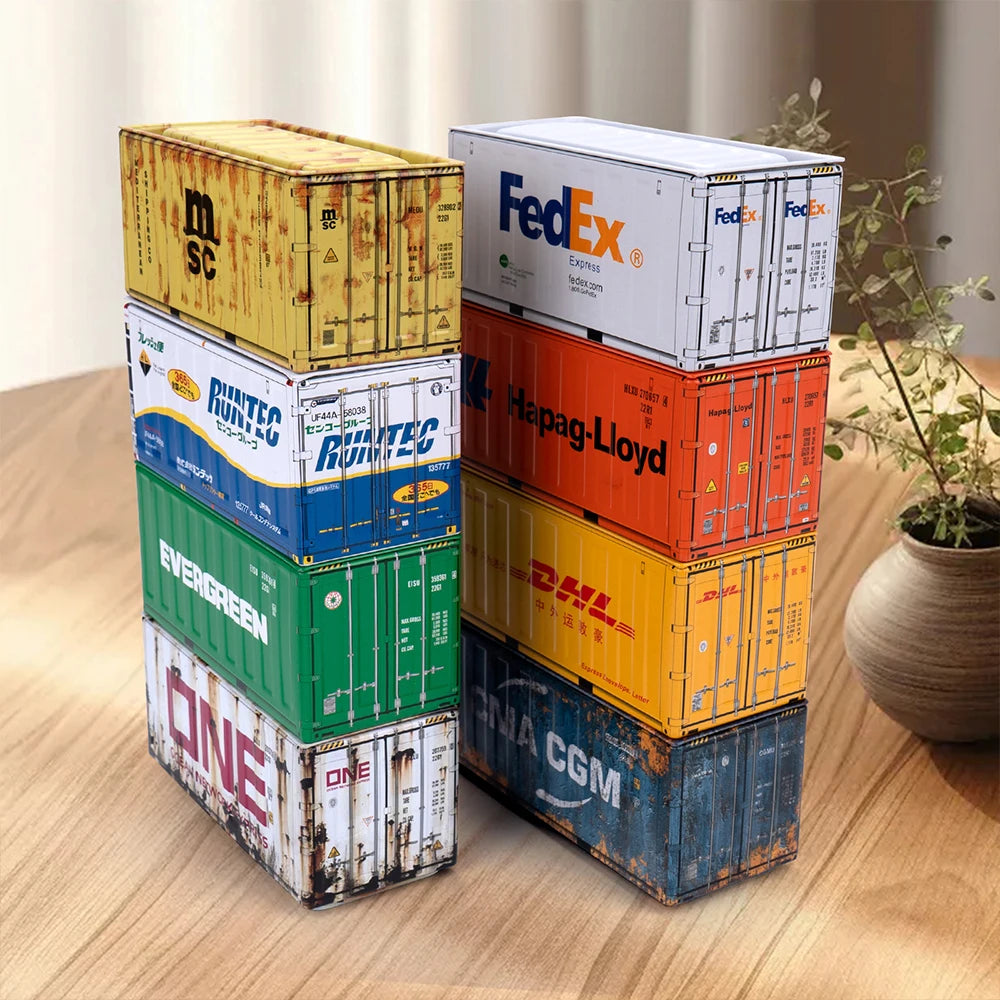 A stack of various colored industrial iron storage boxes, including FedEx, Runtec, and DHL brands, on a wooden surface.