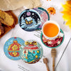 An arrangement of eight diamond painting coasters featuring winter, festive, and celestial designs.