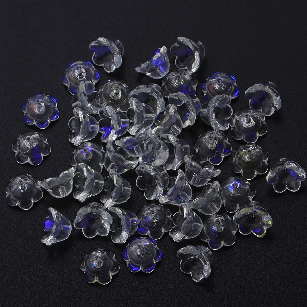 A pile of 50 clear and purple glass cherry blossom flower beads for jewelry making