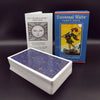 A box of Universal Waite Tarot Deck with a guide book and a stack of tarot cards.