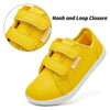 Yellow kids barefoot sneakers with hook and loop closure shown from the side and top view.