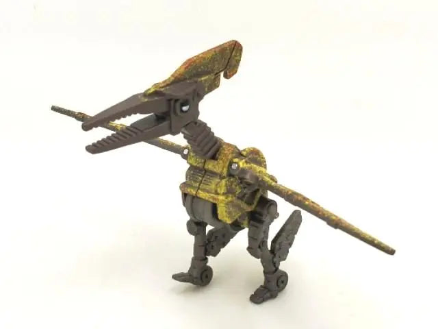 A die-cast dinosaur truck toy with a removable dinosaur figure, painted in earthy tones.
