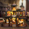 A detailed wooden miniature castle dollhouse kit featuring architecture, furniture, and illuminated elements.