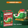 A box of Merry Christmas micro building blocks featuring a red Santa and reindeer figure on a yellow base.
