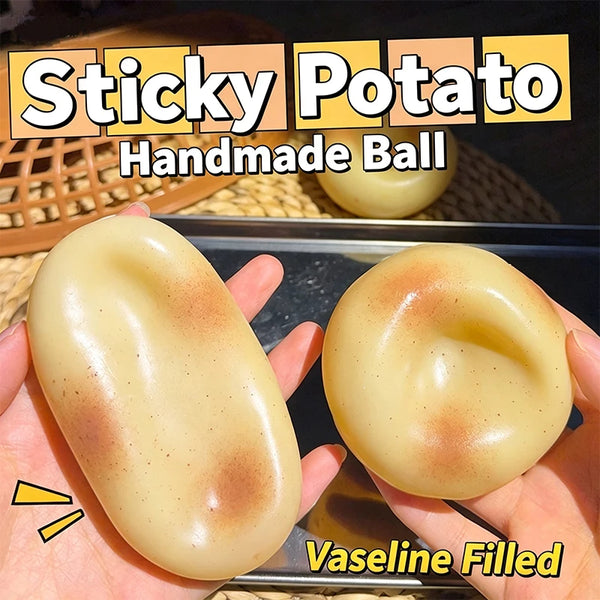A hand holds a yellow handmade ball filled with Vaseline, showing its smooth texture.
