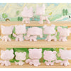 A collection of twelve white pet figures and customizable bases arranged on a wooden shelf.
