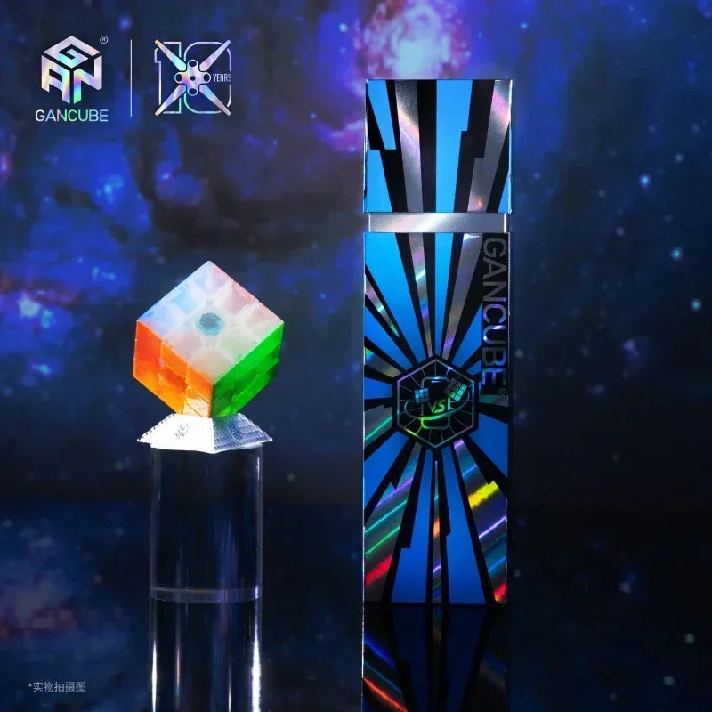A blue and silver magnetic speed cube set displayed next to a translucent green and orange crystal on a dark background.