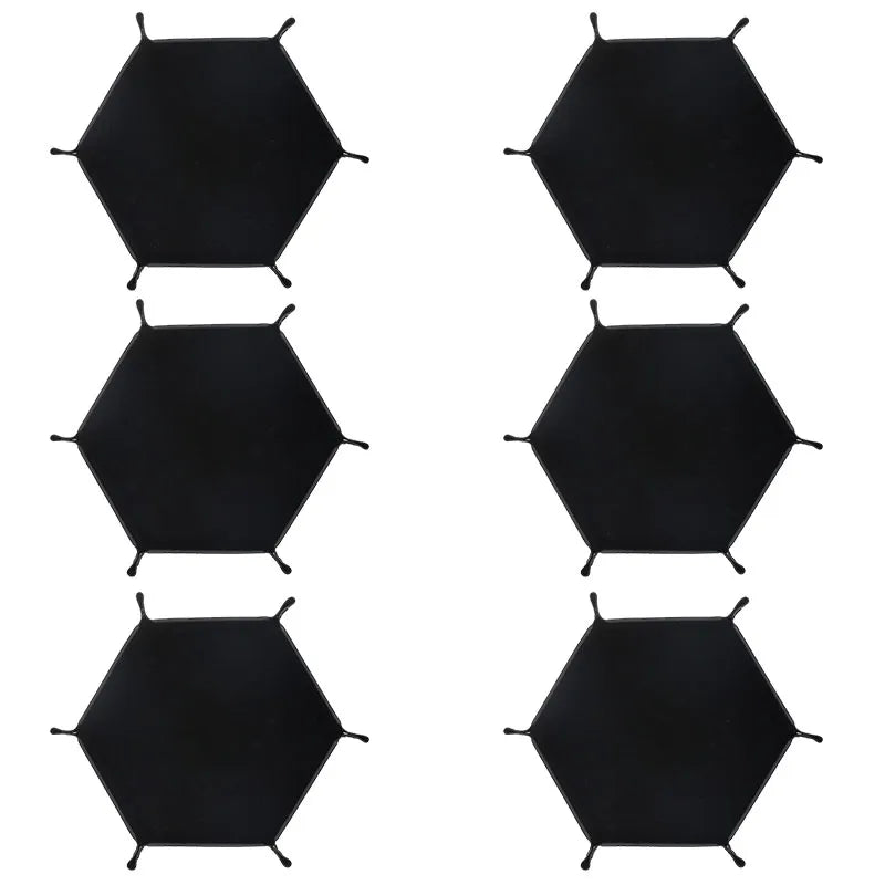 A set of black foldable PU leather hexagonal dice tray for tabletop games and desk organization.