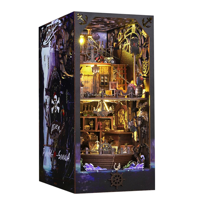 A wooden pirate ship book nook kit featuring an elaborate diorama with rigging and miniature ship elements.