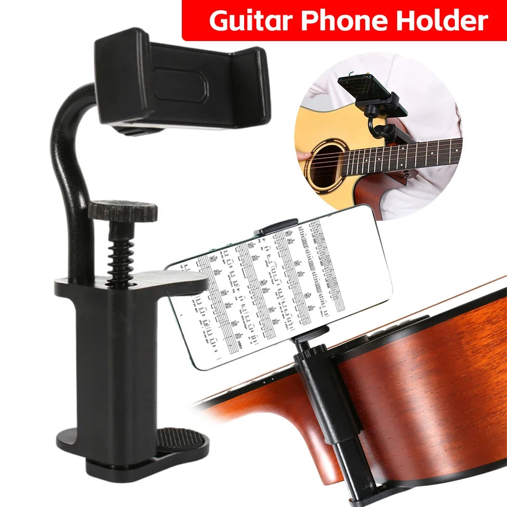 A black clamp-style guitar phone holder designed to mount a smartphone onto a musical instrument.