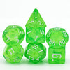 A set of seven translucent green glitter polyhedral dice, including a tetrahedron and a dodecahedron.