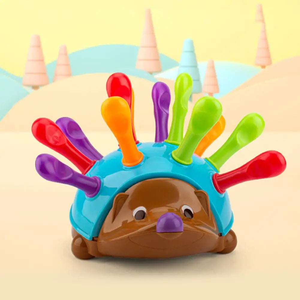 A colorful hedgehog toy with spiky protrusions used for fine motor skills and color sorting.