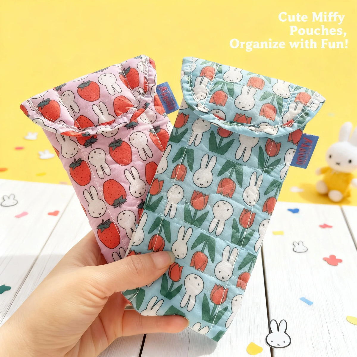 A hand holds a cute Miffy rabbit magnetic storage pouch with various stuffed rabbits and fruits for organizing.