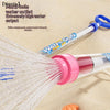 A plastic water gun with a translucent barrel and pink trigger, spraying a stream of water.