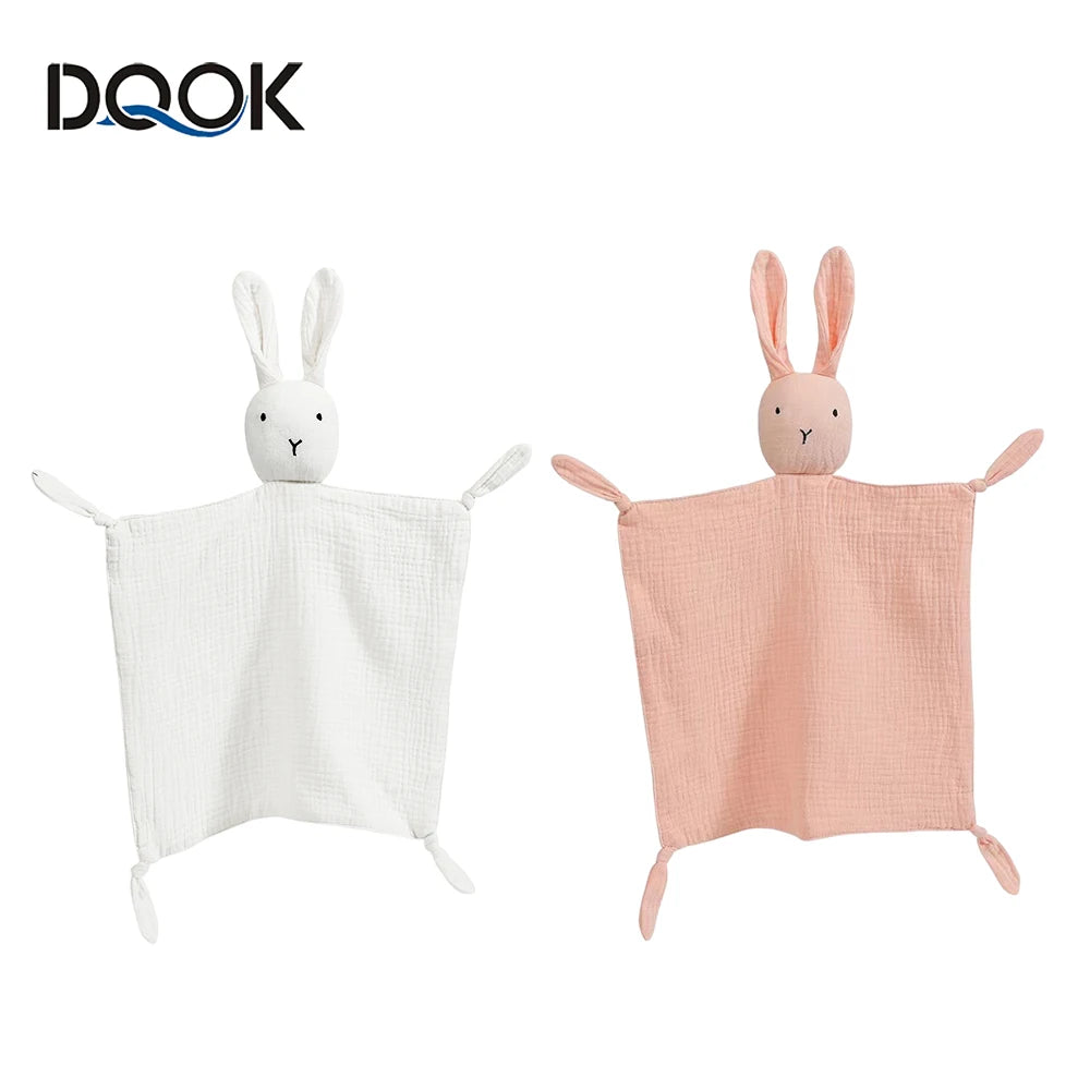 A white and pink soft cotton muslin baby comforter blanket with bunny ears