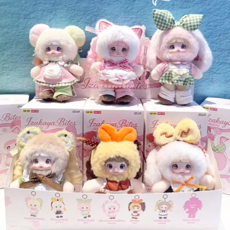 A collection of Izakaya Bites mystery blind box plush keychains featuring various cute characters with pink and green accents