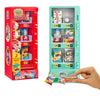 A red mini vending machine toy with various snack dispensers and surprise balls inside.