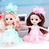 A 17cm articulated princess doll with pink hair and a light blue dress and pink bow accessory.