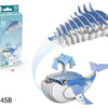 A blue whale 3D paper puzzle model showing the full whale and a separate fin piece.