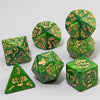 A set of marble dragon pattern polyhedral dice in various shapes and sizes, featuring gold markings on a green marbled surfac