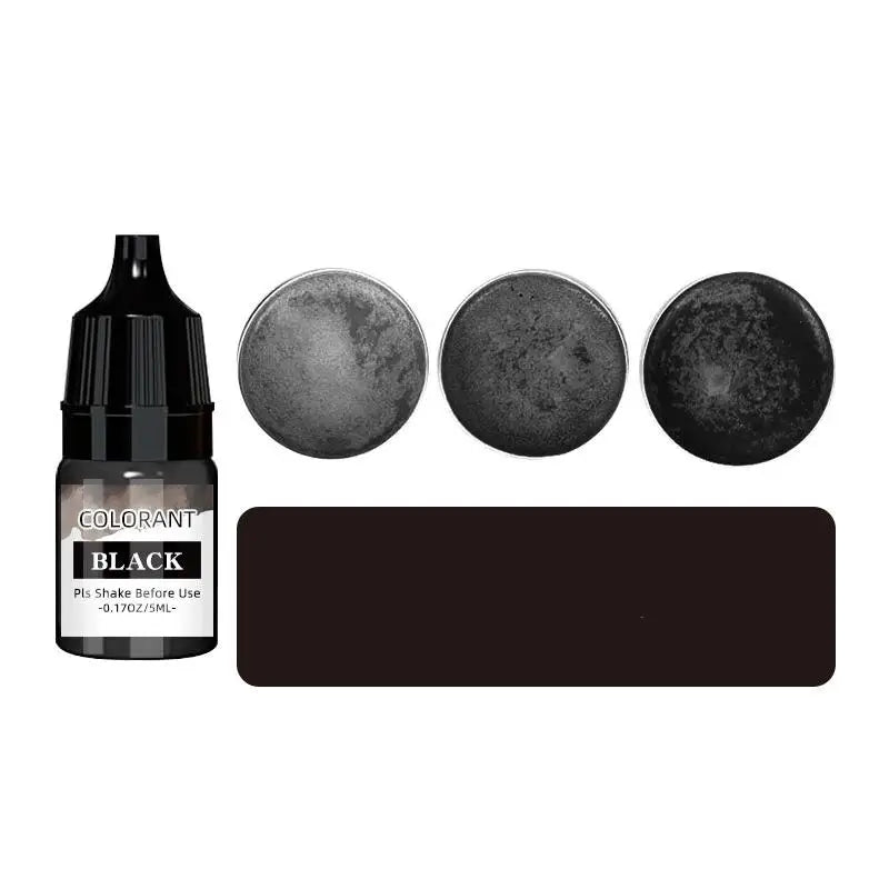 A set of black liquid colorant bottles and circular discs for DIY wax projects.