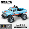 A blue 1:64 scale alloy remote control monster truck with black tires and orange accents.