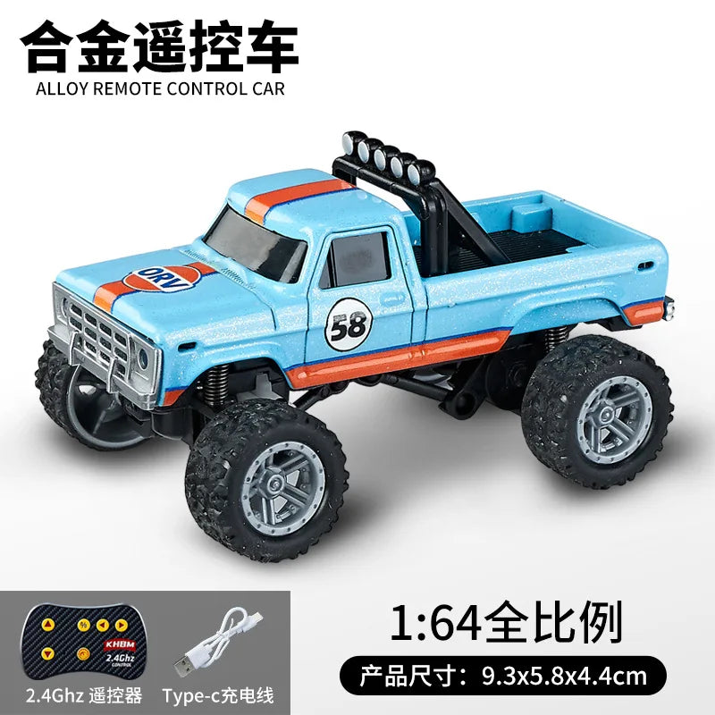 A blue 1:64 scale alloy remote control monster truck with black tires and orange accents.