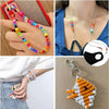 A collection of colorful pony beads used for jewelry making and crafts, shown on a necklace and as loose beads.