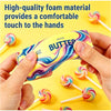 Hands hold a yellow squishy butter toy with colorful swirls, surrounded by other similar toys.