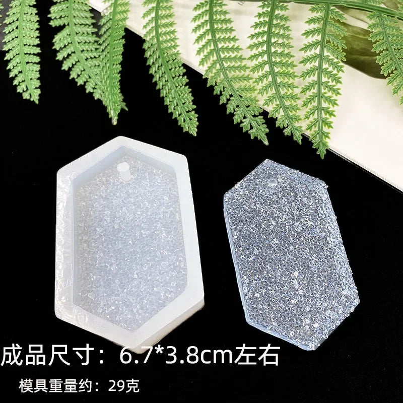 A set of clear silicone resin molds in various shapes including heart, round, oval, and rectangle molds displayed on a dark s