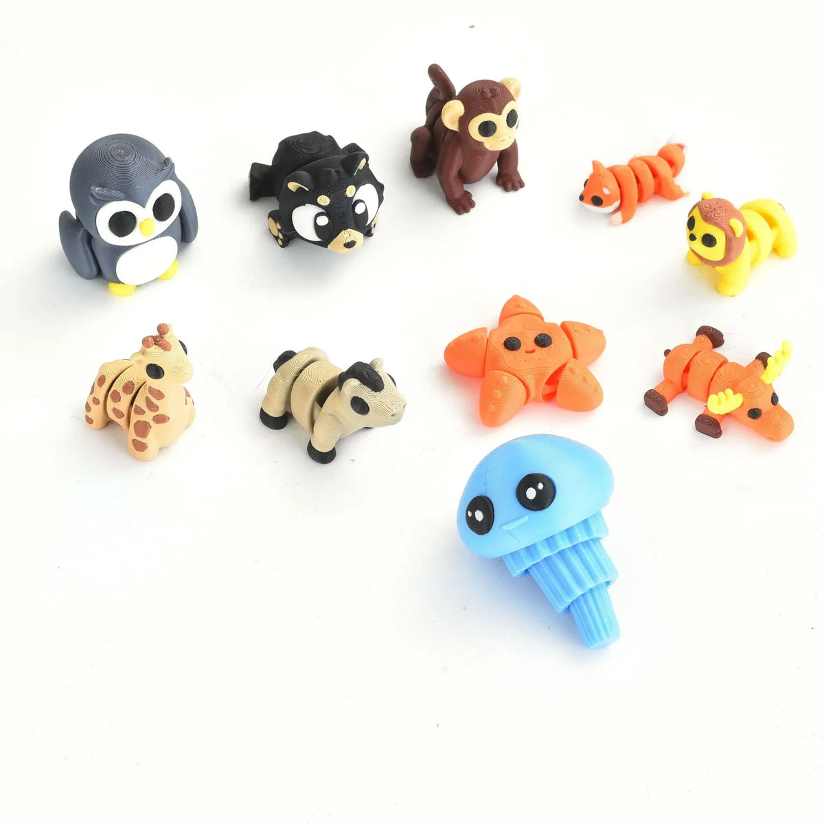 A collection of poseable 3D printed animal figurines in various colors and poses.