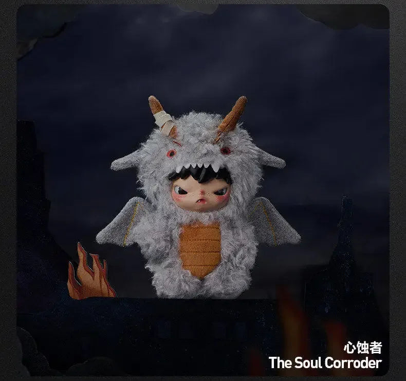 A plush doll pendant of The Soul Corroder featuring a gray, furry creature with horns and a fierce expression.