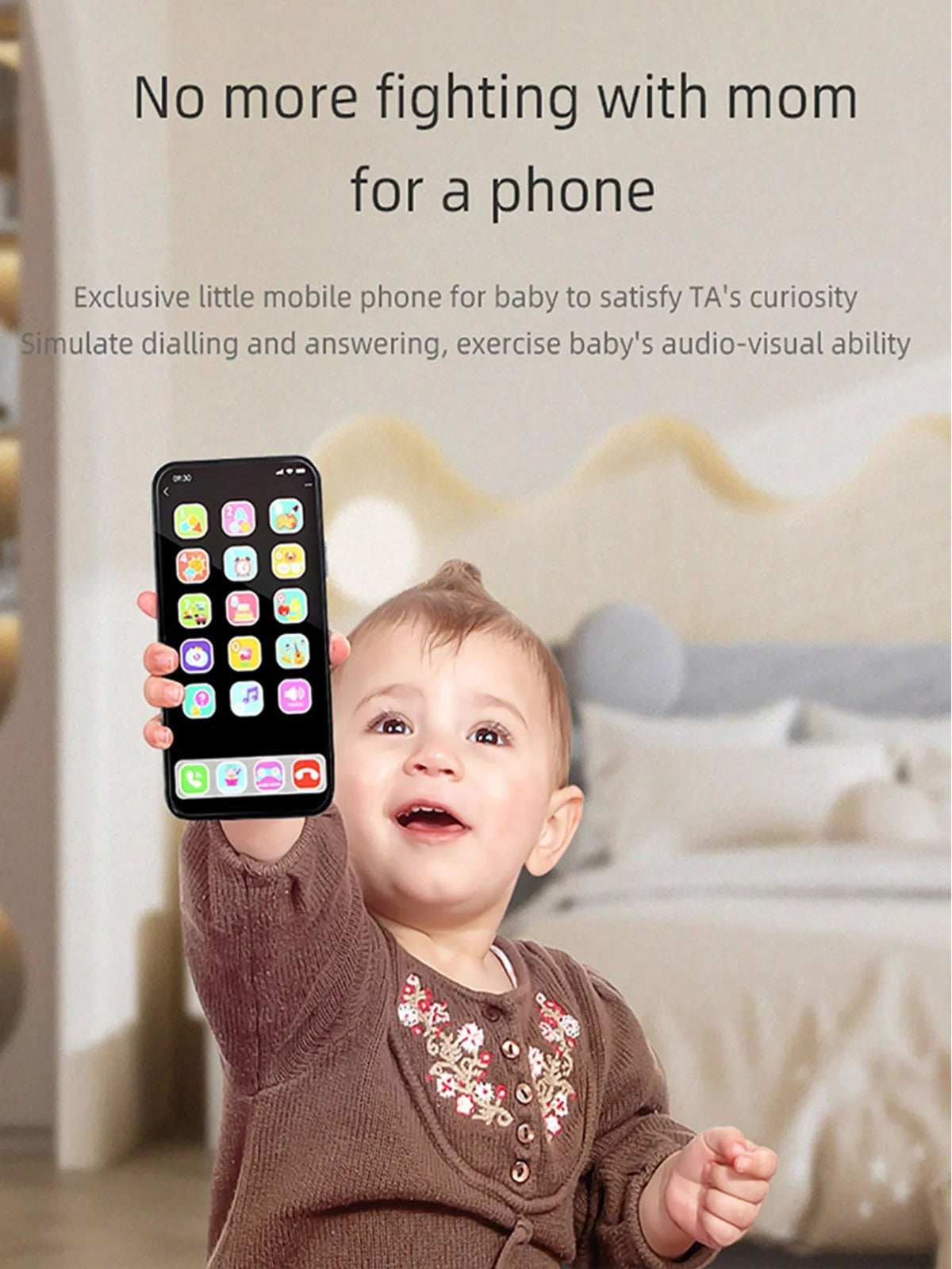 A baby is holding an interactive mobile phone toy with colorful buttons and a speaker, simulating dialing and answering.
