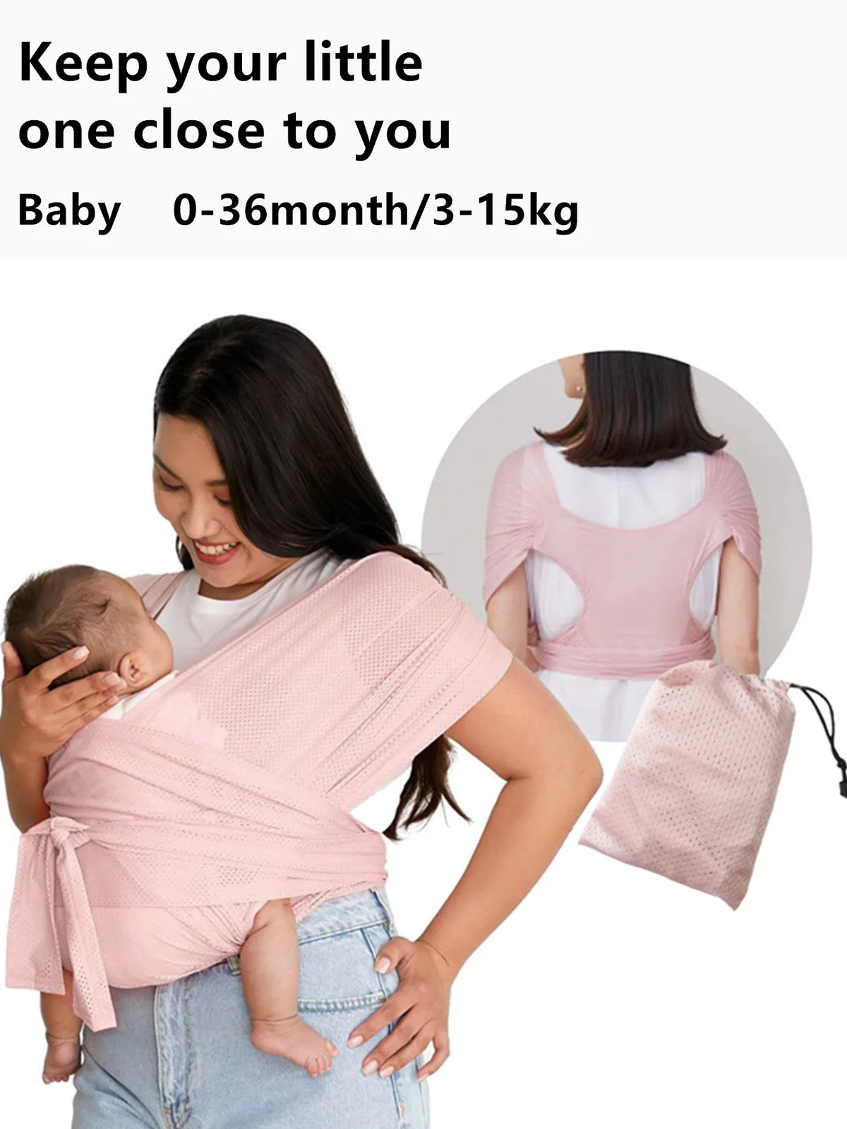 A woman is wearing a pink X-shaped baby sling carrier while holding a baby.