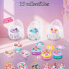 A collection of 15 baby surprise capsule dolls in various colors and outfits displayed on a pink background.
