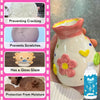 A white ceramic vase decorated with pink floral elements and yellow accents, showing various protective features.
