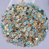 Assorted metal pendants and charms in gold and turquoise colors for jewelry making