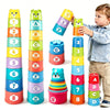 A boy is stacking colorful rainbow cups in a tower, demonstrating the set for sorting and speed games.