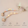 A set of star-shaped wood pacifier clips with silicone beads and silicone rings for baby care and exercise grip.