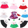 A collection of handmade doll dresses featuring various colors and patterns for 18-inch American Girl dolls.