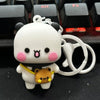 A white cartoon bear and a small brown bear keychain set with a silver ring.