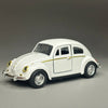 A white classic retro Beetle diecast model car with gold trim, shown in profile.