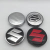 Two Suzuki wheel hub center caps shown, one silver and one red.
