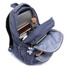 Un sac à dos de voyage bleu foncé et durable, ouvert pour montrer les compartiments pour fournitures scolaires et effets pers